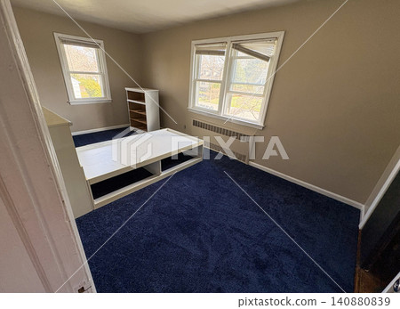 Empty Room With New Blue Carpet aInstalled nd White Furniture 140880839