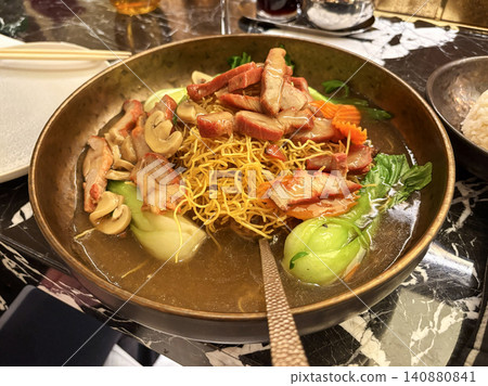 Enjoying a Bowl of Noodles With Meat and Vegetables in Las Vegas 140880841