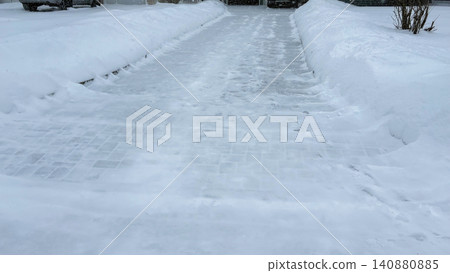Driveway shoveled during snow storm with more snow coming down Driveway shoveled during snow storm with more snow coming down 140880885