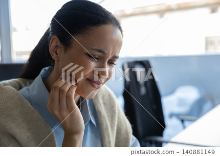 Woman feeling severe tooth pain Woman feeling severe tooth pain 140881149