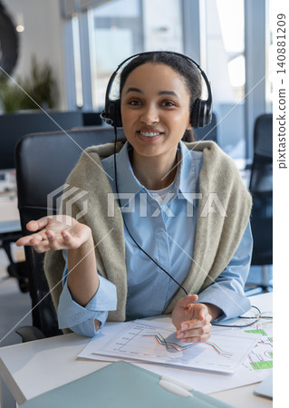 Woman manager wearing headset gesturing Woman manager wearing headset gesturing 140881209