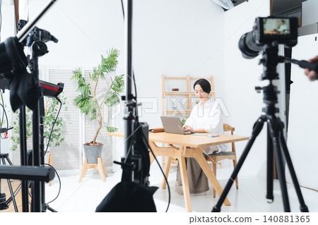 A scene from a model photoshoot in a studio. Recording, camera, video. A scene from a model photoshoot in a studio. Recording, camera, video. 140881365