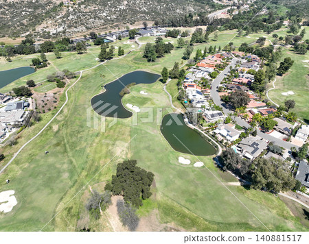 Aerial view of Ramona neighborhood with mountain, valley and golf course Aerial view of Ramona neighborhood with mountain, valley and golf course 140881517