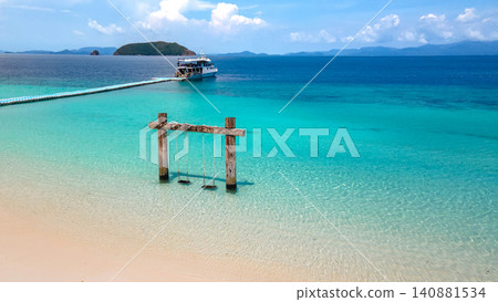 Empty twin wooden swing on Madam beach of Nyaung Oo Phee Island in Myanmar 140881534