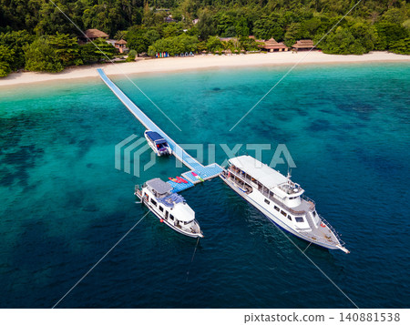 Aerial view of tour boats in front of the resort at Nyaung Oo Phee island in Myanmar 140881538