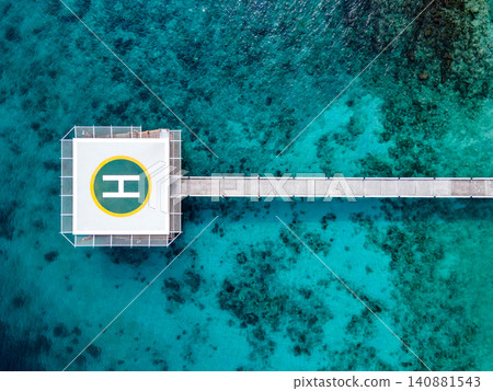 Aerial view of helipad over the sea 140881543