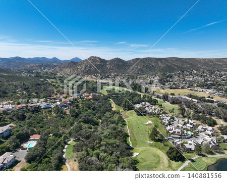 Aerial view of Ramona neighborhood with mountain, valley and golf course Aerial view of Ramona neighborhood with mountain, valley and golf course 140881556