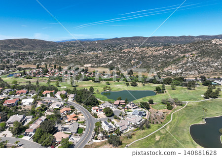 Aerial view of Ramona neighborhood with mountain, valley and golf course Aerial view of Ramona neighborhood with mountain, valley and golf course 140881628