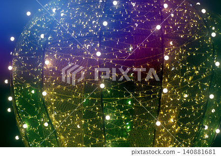 Decorative light installation shining brightly at a festive event in the evening twilight Decorative light installation shining brightly at a festive event in the evening twilight 140881681