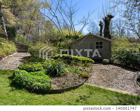 Enlgish green garden with multpiple type of trees and plants 140881747