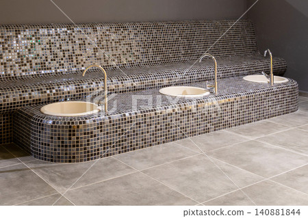 modern spa foot bath area, built-in basins for hydrotherapy treatments modern spa foot bath area, built-in basins for hydrotherapy treatments 140881844