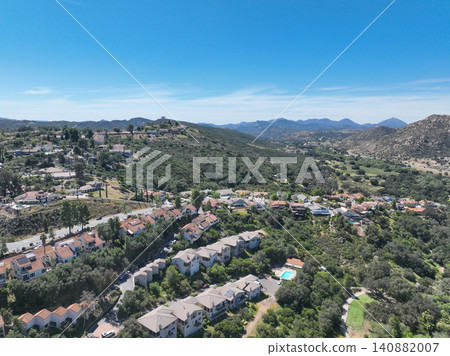Aerial view of Ramona neighborhood with mountain, valley and golf course Aerial view of Ramona neighborhood with mountain, valley and golf course 140882007