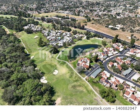 Aerial view of Ramona neighborhood with mountain, valley and golf course Aerial view of Ramona neighborhood with mountain, valley and golf course 140882047