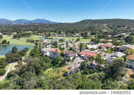 Aerial view of Ramona neighborhood with mountain, valley and golf course Aerial view of Ramona neighborhood with mountain, valley and golf course 140882052