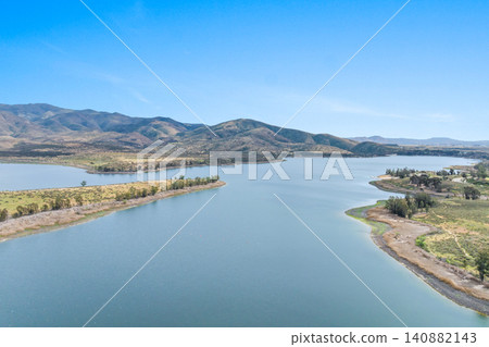 Aerial view Otay Lakes County Park in Chula Vista, California, a scenic view of a mountain range 140882143
