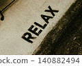 RELAX written on the road 140882494