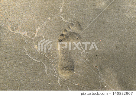 Next the human foot in sand Next the human foot in sand 140882907