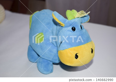 Stitched soft toy fabric on a white background. Animal toy. Stitched soft toy fabric on a white background. Animal toy. 140882990