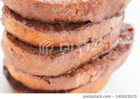 A close-up shot of delicious homemade chocolate rusks against a white background (03) A close-up shot of delicious homemade chocolate rusks against a white background (03) 140883070