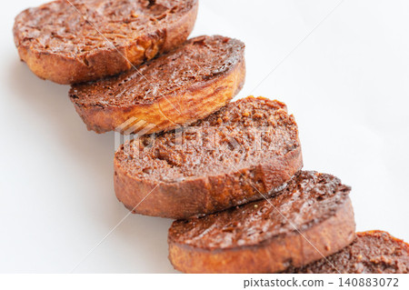 A close-up shot of delicious homemade chocolate rusks against a white background (05) A close-up shot of delicious homemade chocolate rusks against a white background (05) 140883072
