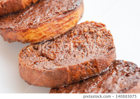A close-up shot of delicious homemade chocolate rusks against a white background (08) A close-up shot of delicious homemade chocolate rusks against a white background (08) 140883075