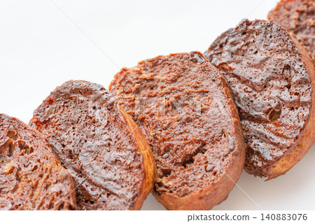 A close-up shot of delicious homemade chocolate rusks against a white background (09) A close-up shot of delicious homemade chocolate rusks against a white background (09) 140883076