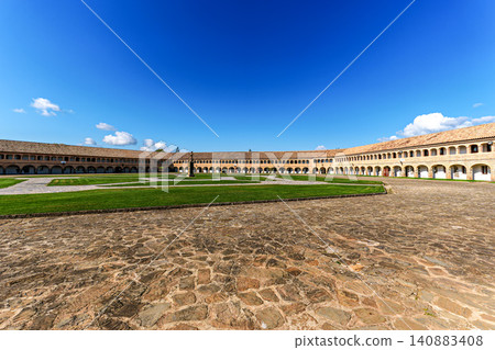 Philip II square with a cannon in the citadel of Jaca, military fortification in Spain. Parade ground of the Fortress Philip II square with a cannon in the citadel of Jaca, military fortification in Spain. Parade ground of the Fortress 140883408