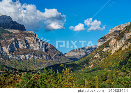 Driving through the Valley of Hecho in the Spanish Pyrenees in autumn, Spain Driving through the Valley of Hecho in the Spanish Pyrenees in autumn, Spain 140883424