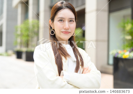 Japanese businesswoman with arms crossed Japanese businesswoman with arms crossed 140883673