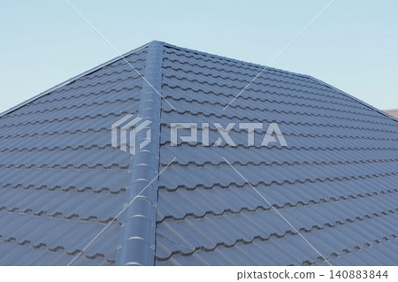 Corrugated metal roof and metal roofing. Modern roof made of metal. 140883844