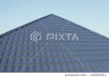 Corrugated metal roof and metal roofing. Modern roof made of metal. Corrugated metal roof and metal roofing. Modern roof made of metal. 140883851