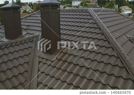Corrugated metal roof and metal roofing. Modern roof made of metal. Corrugated metal roof and metal roofing. Modern roof made of metal. 140883870