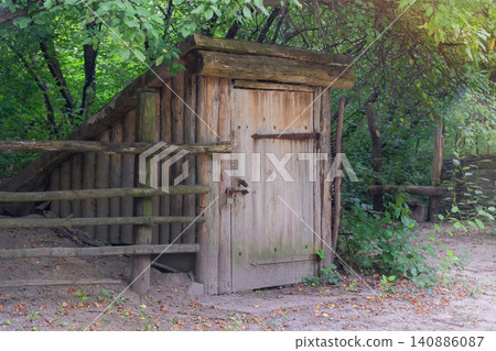 Ancient wooden basement. Countryside in sunny day. Ancient wooden basement. Countryside in sunny day. 140886087