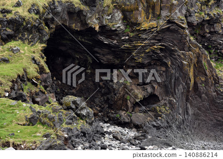 Eroded basalt column formations at Londrangar, Iceland Eroded basalt column formations at Londrangar, Iceland 140886214