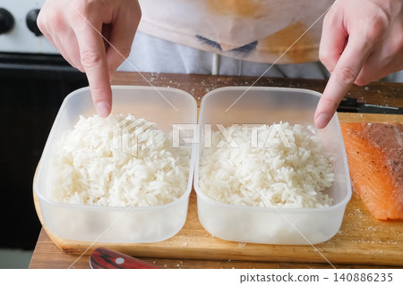 Rice porridge in plastic containers, preparing food Rice porridge in plastic containers, preparing food 140886235
