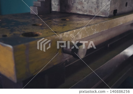press mechanism at the factory, extrusion of parts. press mechanism at the factory, extrusion of parts. 140886256