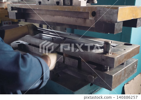 press mechanism at the factory, extrusion of parts. press mechanism at the factory, extrusion of parts. 140886257