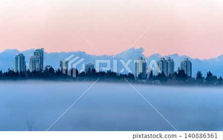 Modern City Skyscrapers Flying in the Sky. Rising Above a Dense Low Fog 140886361