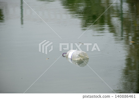 Marine Plastic Pollution with Discarded Bottle. Marine Plastic Pollution with Discarded Bottle. 140886461