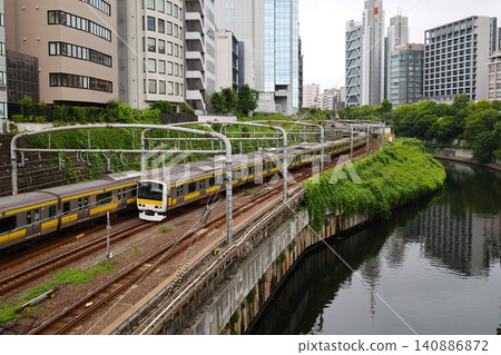 The Chuo Line and Sobu Line run along the Kanda River in Ochanomizu, Tokyo. The Chuo Line and Sobu Line run along the Kanda River in Ochanomizu, Tokyo. 140886872
