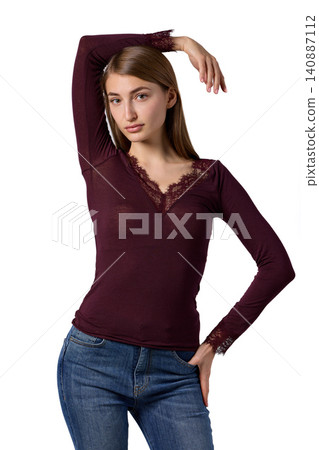 Slavic woman in burgundy lace top and jeans Slavic woman in burgundy lace top and jeans 140887112