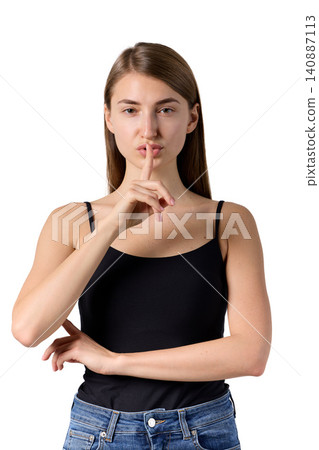 Slavic woman making quiet gesture in studio portrait 140887113