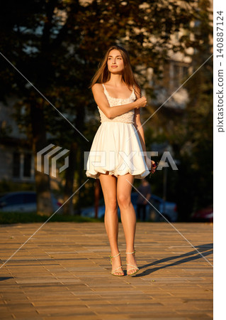 Slavic Woman Walking in Warm Golden Light Slavic Woman Walking in Warm Golden Light 140887124