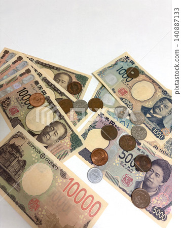 Japanese banknotes and coins spread out Japanese banknotes and coins spread out 140887133
