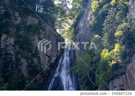 Waterfalls cascading down the mountainside in Sounkyo Gorge 140887228