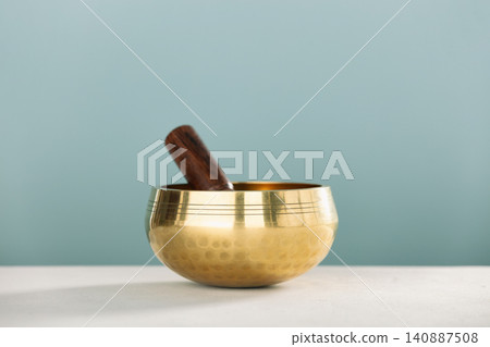 Golden Singing Bowl with Wooden Mallet for Meditation Golden Singing Bowl with Wooden Mallet for Meditation 140887508