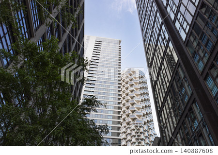 Modern skyscrapers in Canary Wharf London looking up Modern skyscrapers in Canary Wharf London looking up 140887608