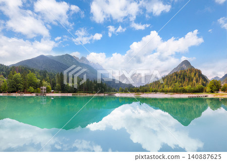 Gorgeous landscape on Jasna lake with beautiful reflections of the mountains. Gorgeous landscape on Jasna lake with beautiful reflections of the mountains. 140887625