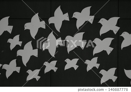 A picture of a bird in flight is posted on the wall. A picture of a bird in flight is posted on the wall. 140887778