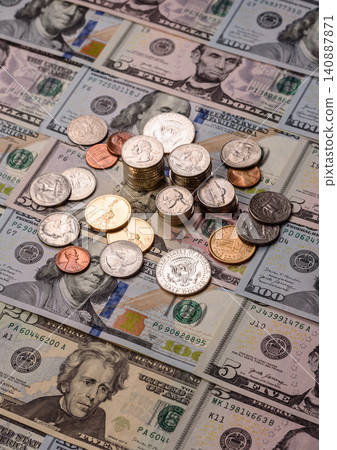 Paper US dollar bills of various denominations and cent coins as a business tool. Cash US dollars Paper US dollar bills of various denominations and cent coins as a business tool. Cash US dollars 140887871